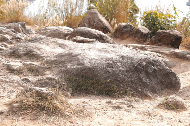Experience a breathtaking view of a majestic ancient rock formation beautifully set in a picturesque natural landscape