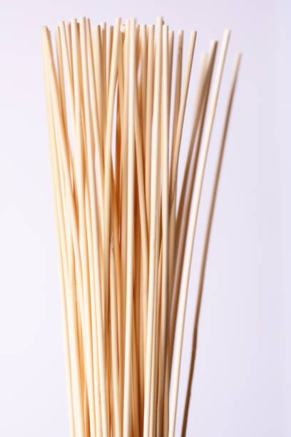 istock A collection of bamboo sticks arranged neatly on a white background, suitable for use in design or photography projects 2206249247