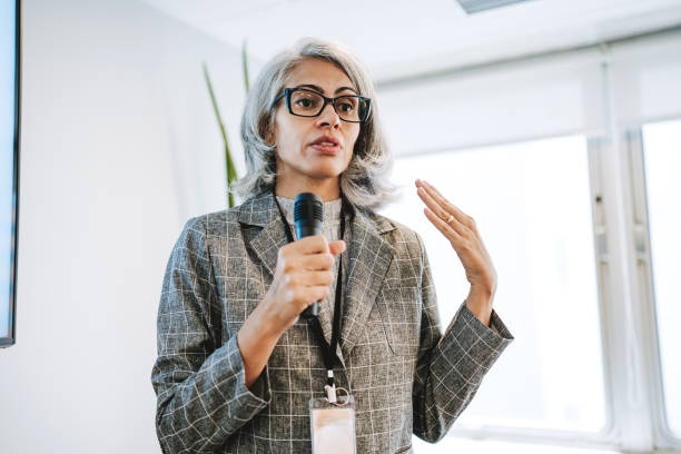 istock Woman giving speaker presentation 2206249458