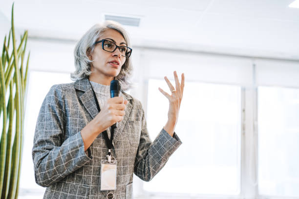 istock Woman giving speaker presentation 2206249466