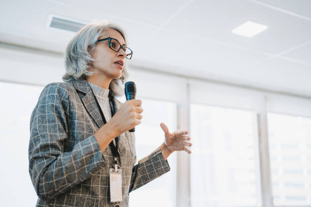 istock Woman giving speaker presentation 2206249471
