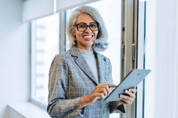 istock Portrait of a mature woman using a digital tablet 2206249501