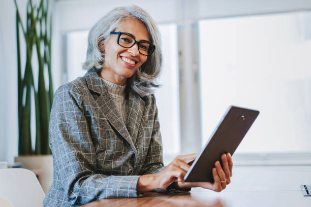 istock Portrait of a mature woman using a digital tablet 2206249507