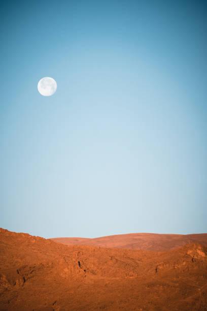 istock Full moon and desert mountains, Morocco 2206250955