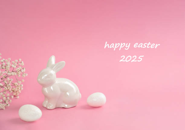 istock Happy Easter 2025 greeting with bunny and eggs on pink background 2206253213