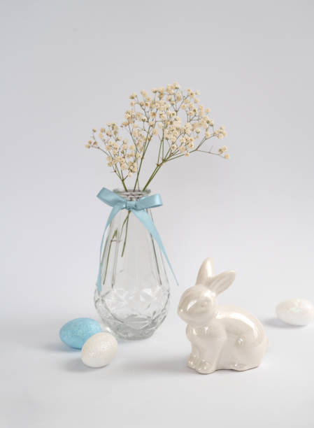 istock Easter still life with ceramic bunny, eggs, and flowers 2206253215