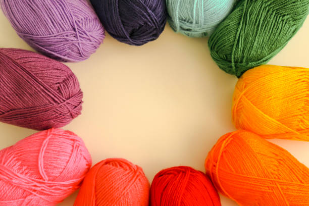 istock Balls of wool in various colors, on white background 2206254567