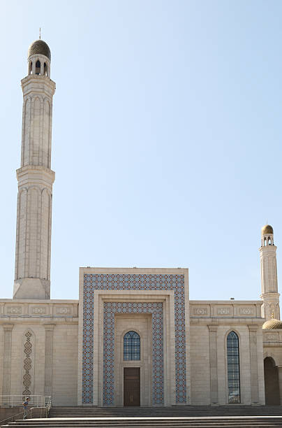 istock Beautiful mosque with minarets under a clear sky 2206255793