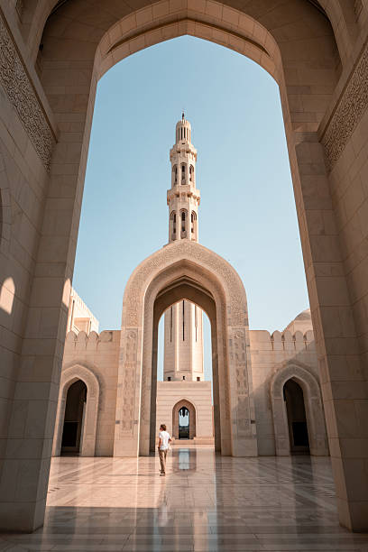 istock Young man explores Sultan Qaboos Grand Mosque, Muscat 2206255993