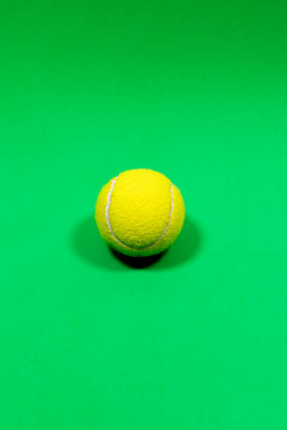 istock Tennis ball on a green background 2206258657
