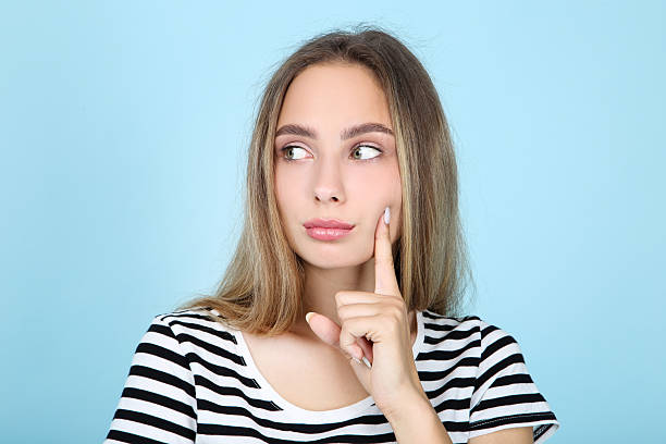istock Beautiful young woman on blue background 2206258891