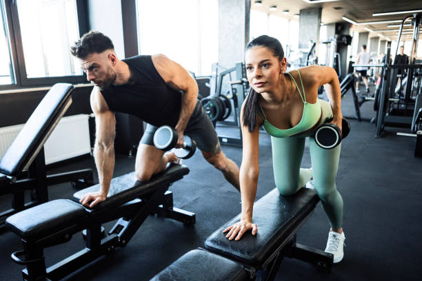 istock Couple Training with Dumbbells at the Gym 2206261845