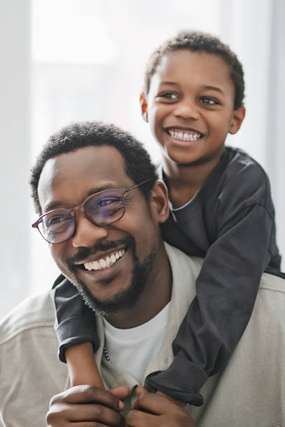 istock Father and son having great time on the livingroom 2206262088