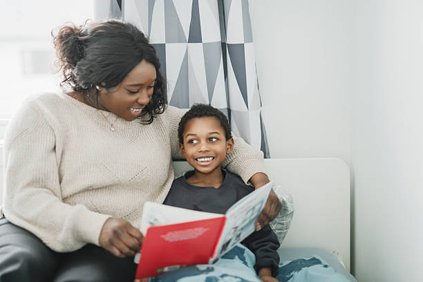 istock mother doing reading exercises together with his son 2206262377