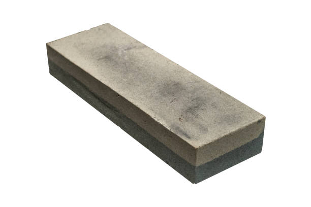 istock A used sharpening stone with visible wear is isolated. 2206268782