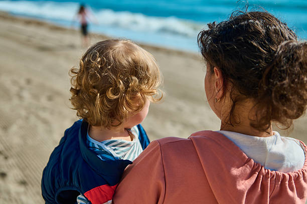 istock Mother and Child Enjoying Bonding Time at the Beach 2206270965