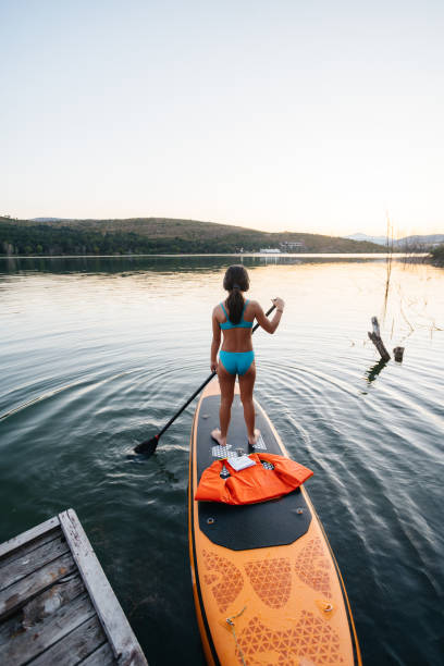istock Girl Exploring the Lake on a Paddleboarding Adventure 2206271435
