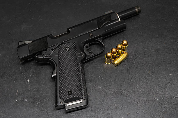istock 45 caliber pistol with a slide stop and cartridges. 2206272665