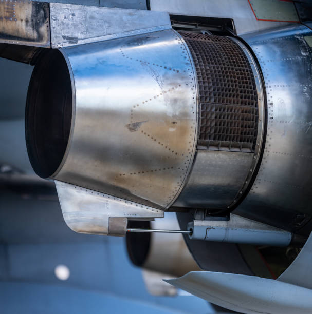 close-up view of jet engine exhaust nozzle and surrounding components.