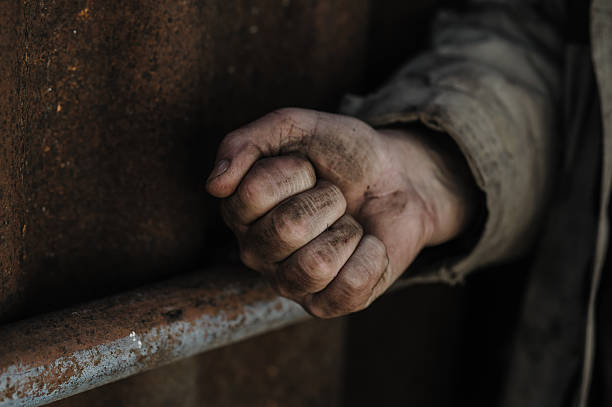 istock The hands of a poor man. 2206276642