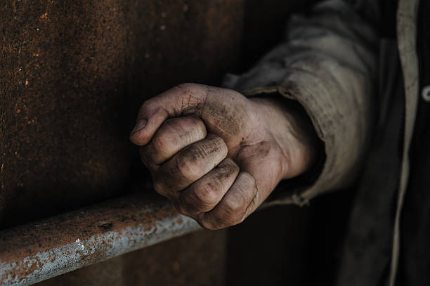 istock The hands of a poor man. 2206276654
