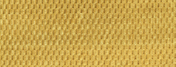 istock Texture yellow and golden fluffy fabric background with rhomboid pattern, macro. Abstract backdrop from ocher textile 2206278334