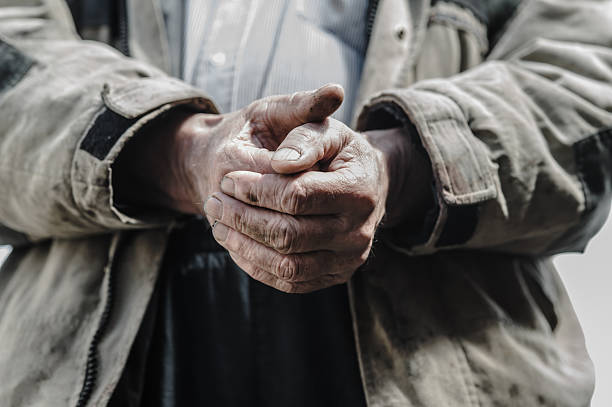 These hands have worked the land for decades. His old hands hold the weight of experience. Only strong hands like these can endure such a life.