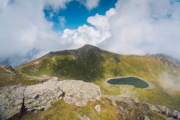 istock Hidden Mountain Lake in the Clouds 2206279499