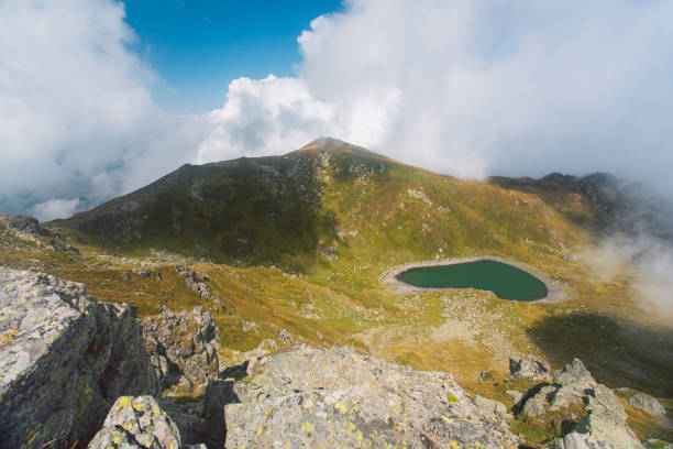istock Hidden Mountain Lake in the Clouds 2206279514