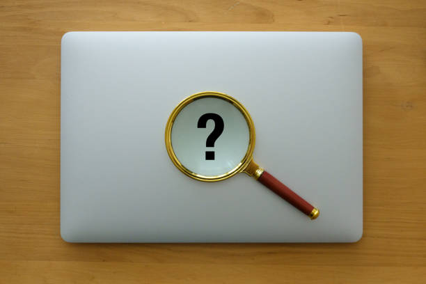 The combination of a magnifying glass and a keyboard could symbolize the use of technology as a tool for learning and discovery.