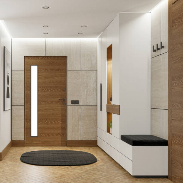 A sophisticated entrance area of a luxury home, apartment, or penthouse, featuring white stone tiles, warm wooden accents, a sleek wooden door, and a modern wardrobe closet. Elegant ceiling LED lights and striped hidden LED lighting add a contemporary touch. Ideal for concepts related to architecture, interior design, luxury living, and home decor.