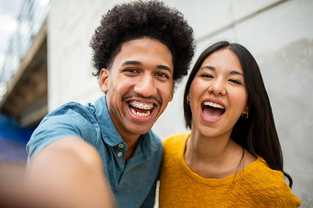 istock Close up happy young couple taking selfie together 2206286697