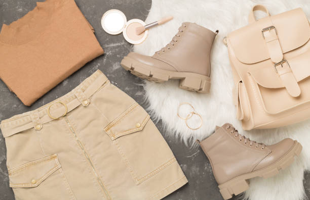istock Flat lay with trendy spring outfit on concrete background, top view 2206289542