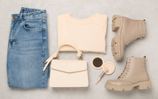 istock Flat lay with trendy spring outfit on concrete background, top view 2206289543