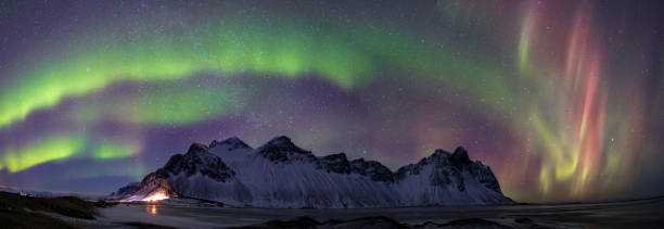 istock Beautiful northern lights in Stokksnes (South Iceland) 2206292011