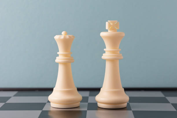 istock White king and queen chess pieces standing on a chessboard 2206295719