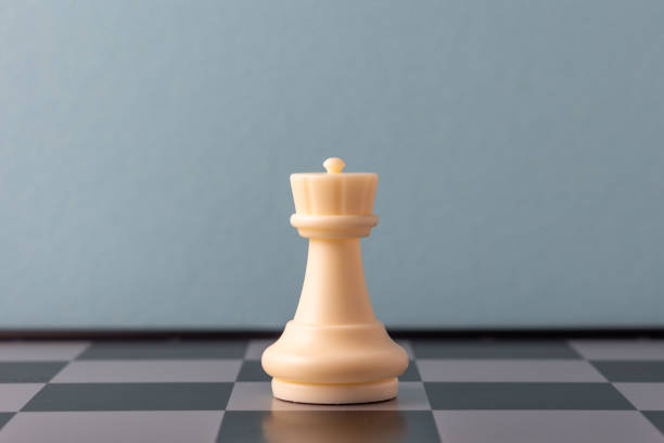 istock White queen chess piece standing on a chessboard 2206295737