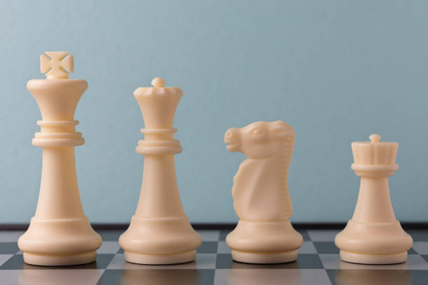 istock Chess pieces on a chessboard ready to start a strategic game 2206295740