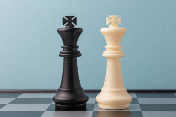 istock Black and white king chess pieces standing on a chessboard 2206295757