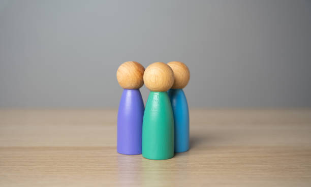istock Three human figures. Team or group. Assistance, cooperation and collaboration. A meeting. Friendly relations. Communication and discussion. 2206304059