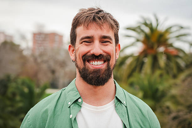 istock A happy man with a delightful smile showcasing his joyful demeanor while engaging in a friendly interaction that exudes warmth and positivity, capturing the essence of uplifting moments in life. 2206308468