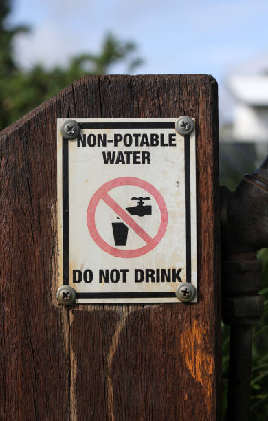 istock Non-Potable Water - Do Not Drink sign attached to a brown wooden post 2206319310