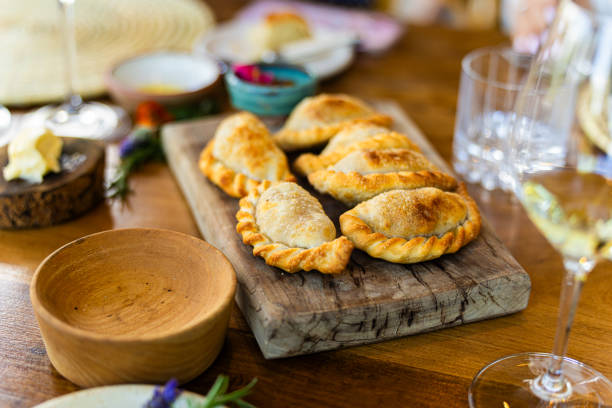 Baked empanadas on wooden board