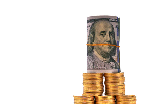 istock Folded 100 dollar bill with tenge coins. Money exchange 2206324517