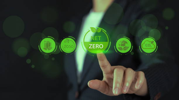 istock Net zero and sustainable energy solutions, A businessman uses a digital pen to interact with holographic icons representing renewable energy, sustainability 2206327944