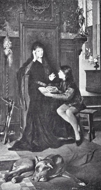 istock Mother teaching the daughter, both sitting in living room, daughter holding an open book on mother's lap, mother gesturing, dog lying in the foreground on the floor 2206330407