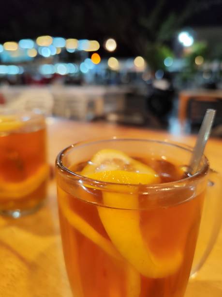 istock Warm lemon juice in a glass on the table 2206334111