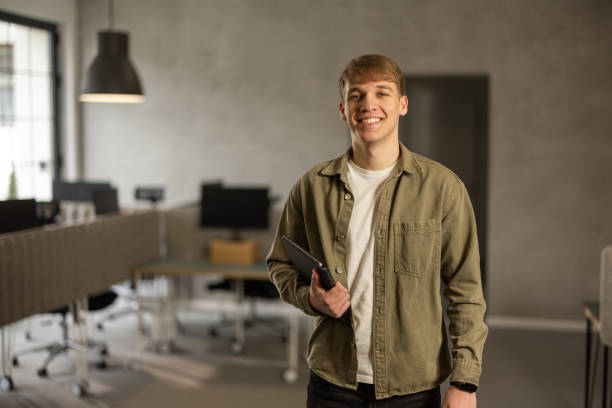 istock Portrait of young man at work place 2206334897