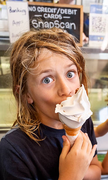 istock Little boy enjoying ice cream with joyful expression 2206337059