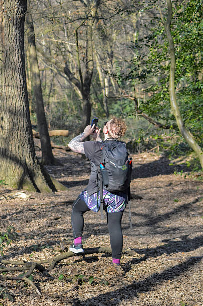 istock Hiker Photographing Nature in a Woodland Setting 2206337442